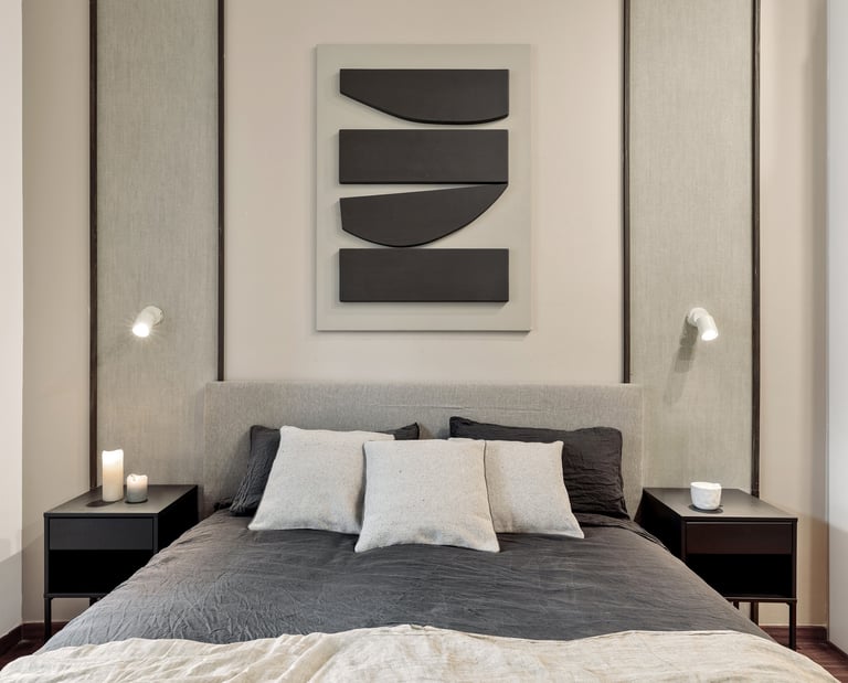 Elegant bedroom design with custom wall panels and bold decor details, designed by SAVIA