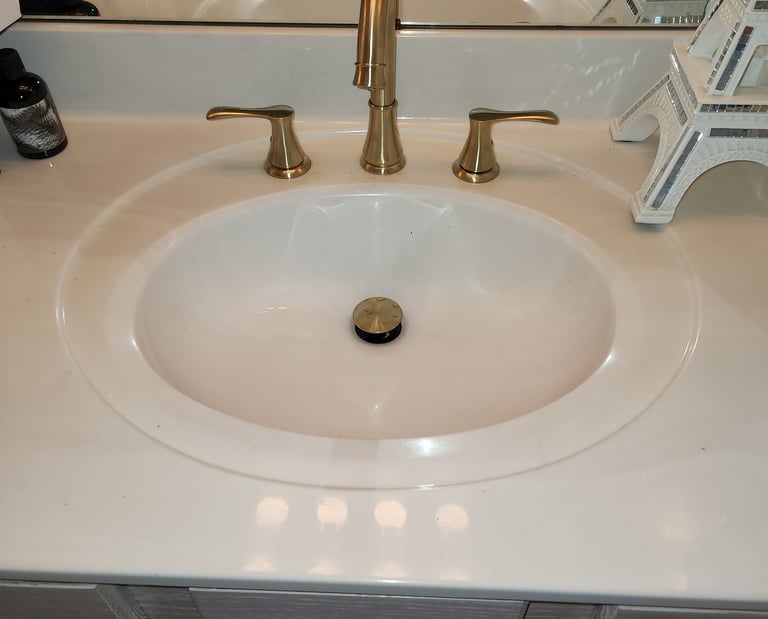a sink with a sink and a mirror