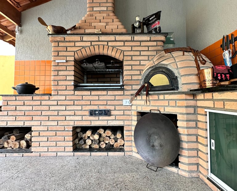 a brick oven with a pizza oven and a pizza oven
