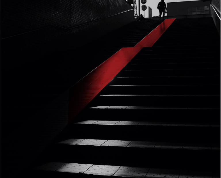 a person walking up stairs in a dark room
