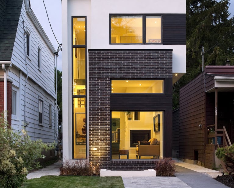 a house with a large window and a small patio