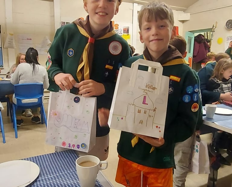 Cub Scouts smiling inside the 25th Allerton Scout Hut in South Liverpool
