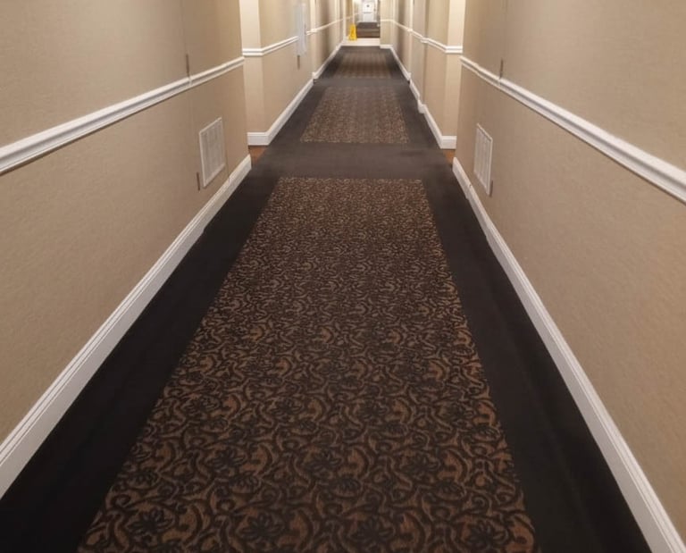 Professional deep steam cleaning results on a high-traffic hotel hallway carpet in Cumberland, RI, p