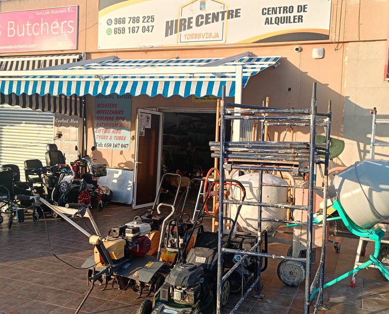 Torrevieja hire centre storefront with rental equipment like cement mixers, lawnmowers, and wheelchairs.