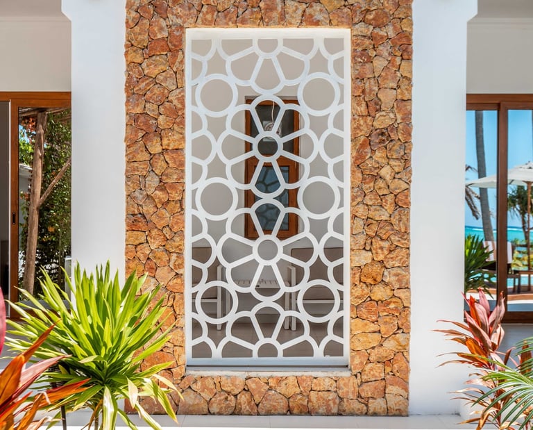 a house with a stone wall and a stone wall