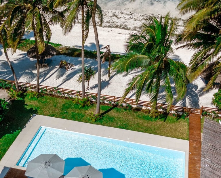 a pool with a view of the ocean, Villa serene Zanzibar 