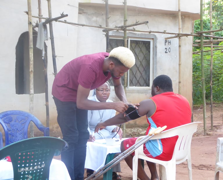Missionary sister assisting community member during outreach service