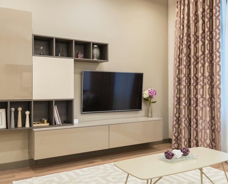 a living room with a television and a couch
