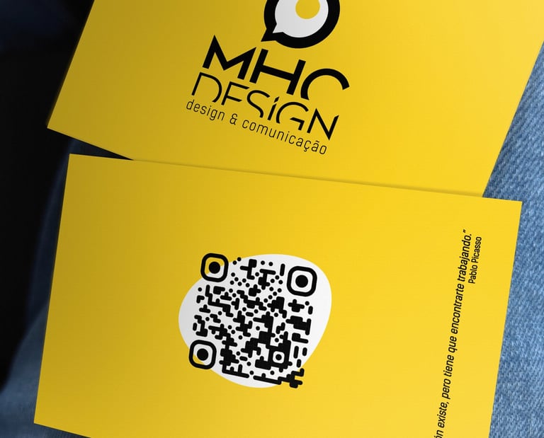 a person holding a qr code on a yellow business card