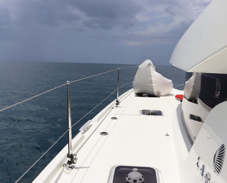 Front deck of Kephas luxury catamaran sailing the Pacific Ocean in Guanacaste