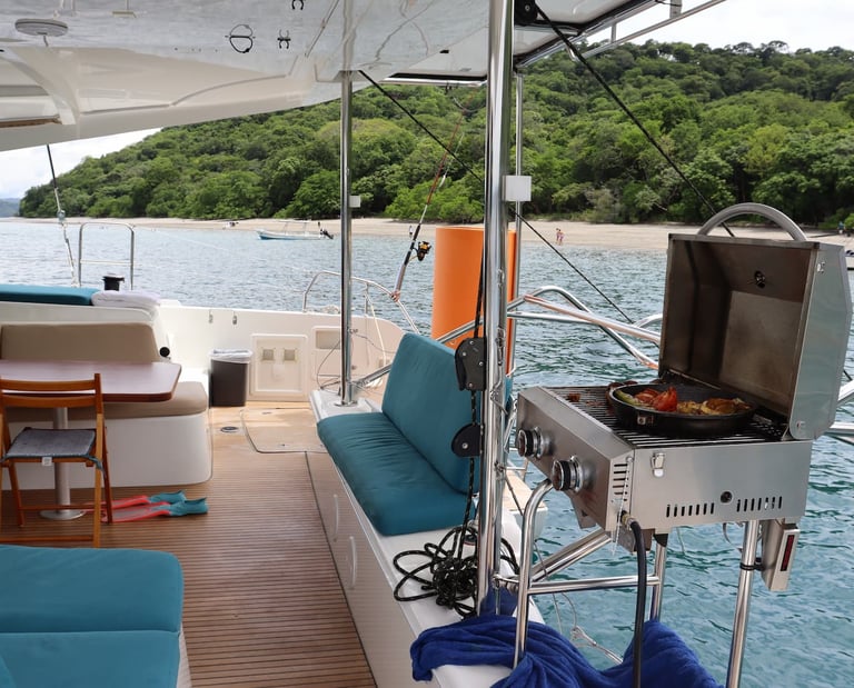 Fully equipped onboard kitchen where private chef prepares gourmet meals during catamaran tour Guanacaste