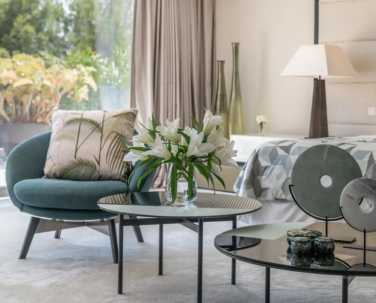 Villa Serenity suite with modern décor and floral arrangement