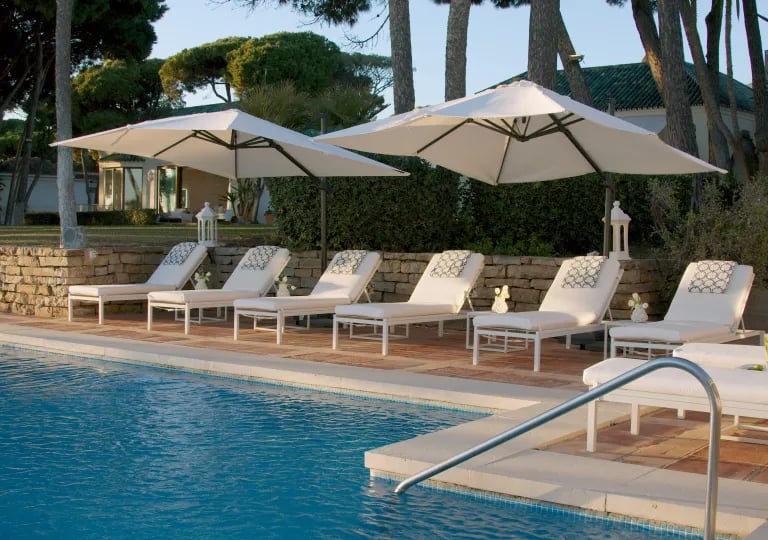 Sun loungers by the main pool at Villa El Rincon