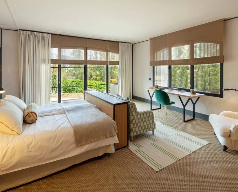 Bright twin bedroom overlooking gardens at Villa La Gratitud