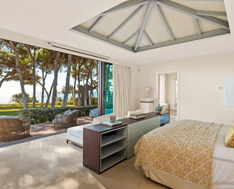 Bedroom at Villa El Rincon with canopy ceiling and sea views 