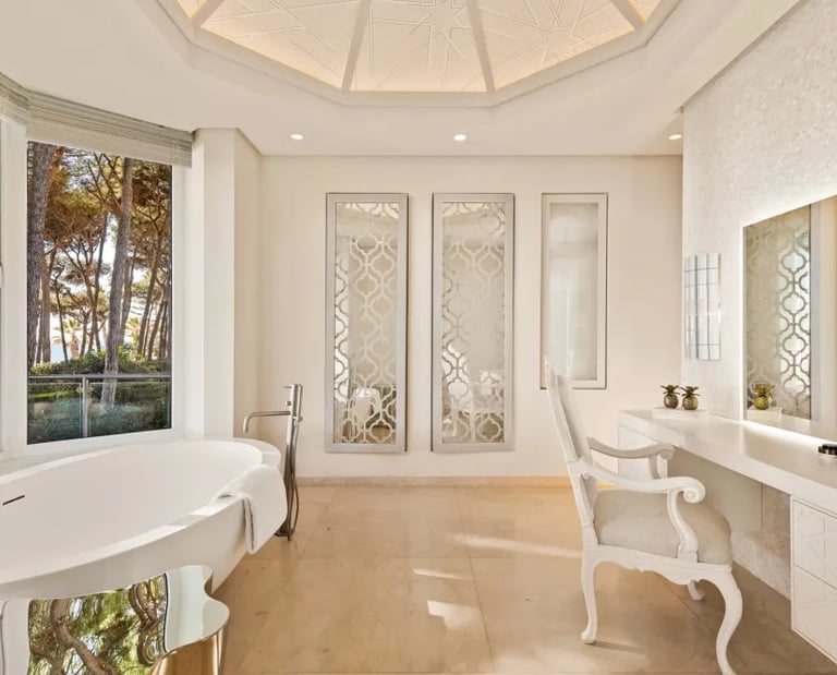 Bathroom at Villa El Rincon with freestanding tub and garden views
