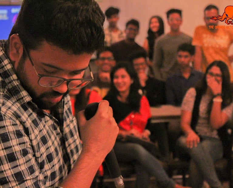 Namit Jain, a stand up comedian, performs at an Orange Octopus event in 2018
