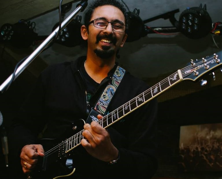Amar Kulkarni, a singer-songwriter performs at an Orange Octopus event in 2018