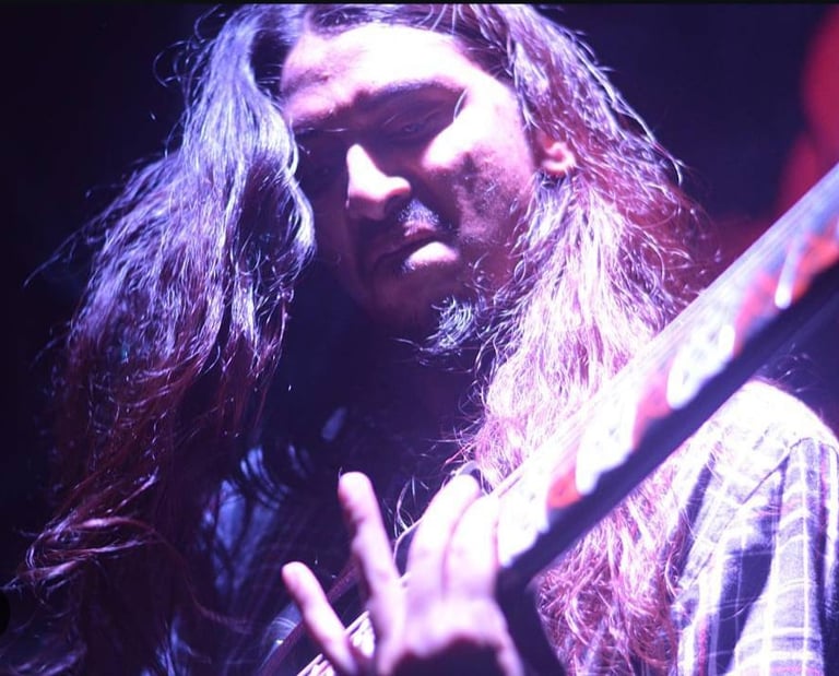 Mohanish Deshmukh, a guitarist, performs with his band Dark Helm at an Orange Octopus event in 2016