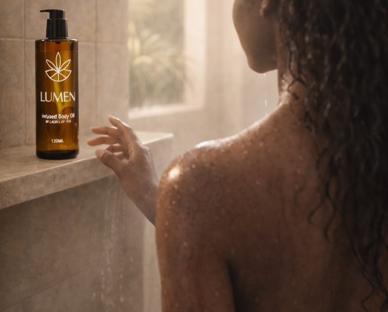 A woman reaches for LUMEN infused body oil on a shower shelf for luxury skincare and hydration.