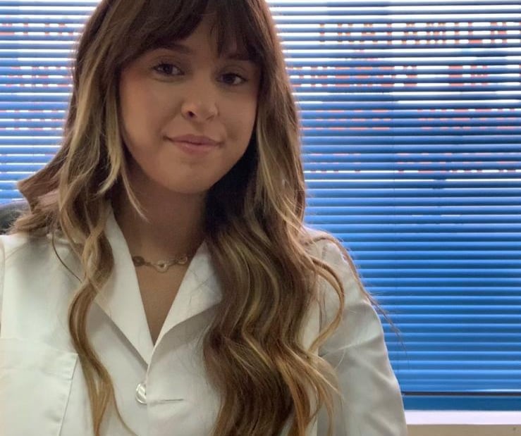 a woman in a white lab coat and a white lab coat