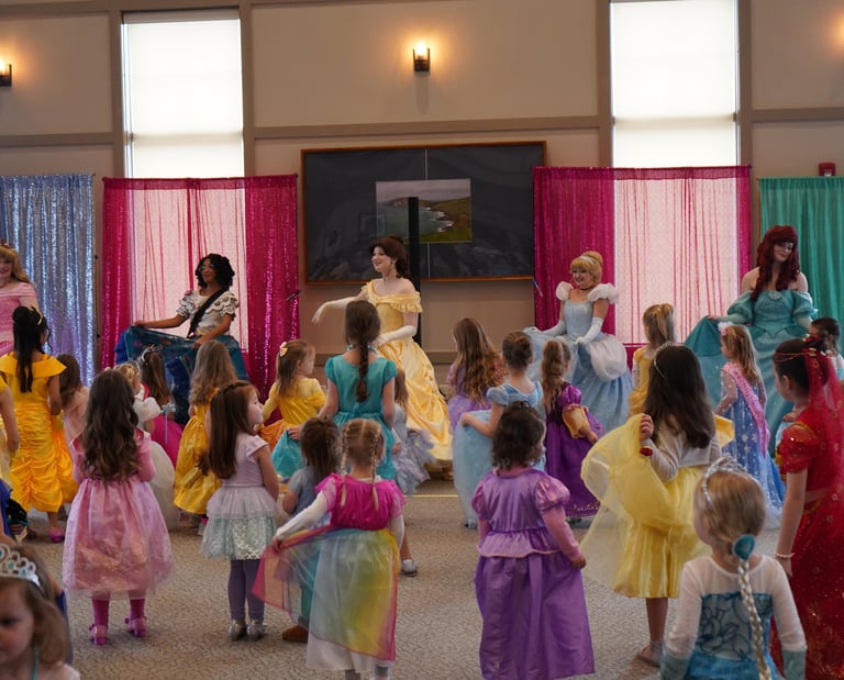 Princesses perform a dance at a ball
