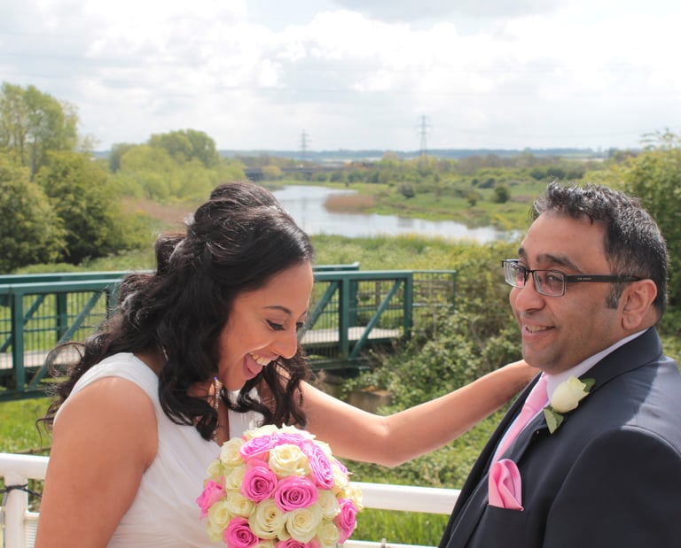 a bride and groom on the top deck of the ark northampton, with midsummer meadow nature reserve