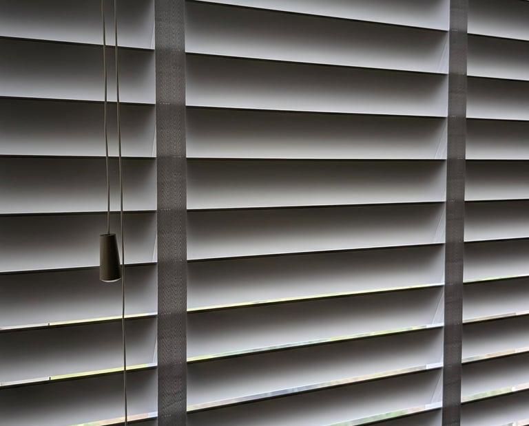 Wooden Venetian blind with decorative tapes installed in Aberdeen window