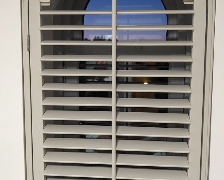 Shaped plantation shutter fitted to arched window in Aberdeen