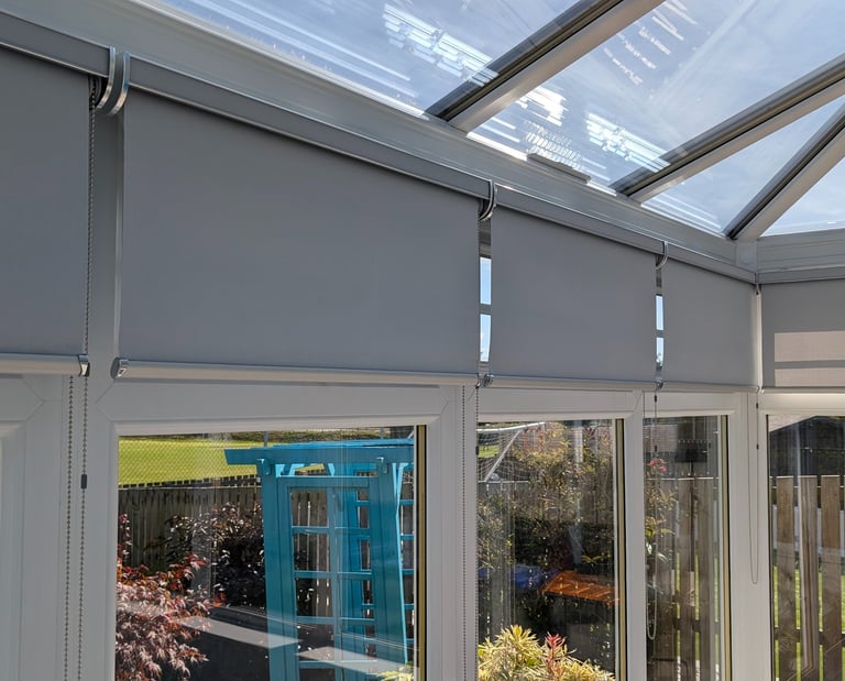 Blackout roller blinds in cassette headbox installed in Aberdeen conservatory