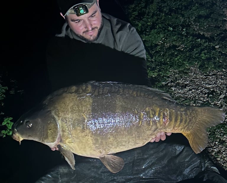 a man holding a fish carp carp carp carp
