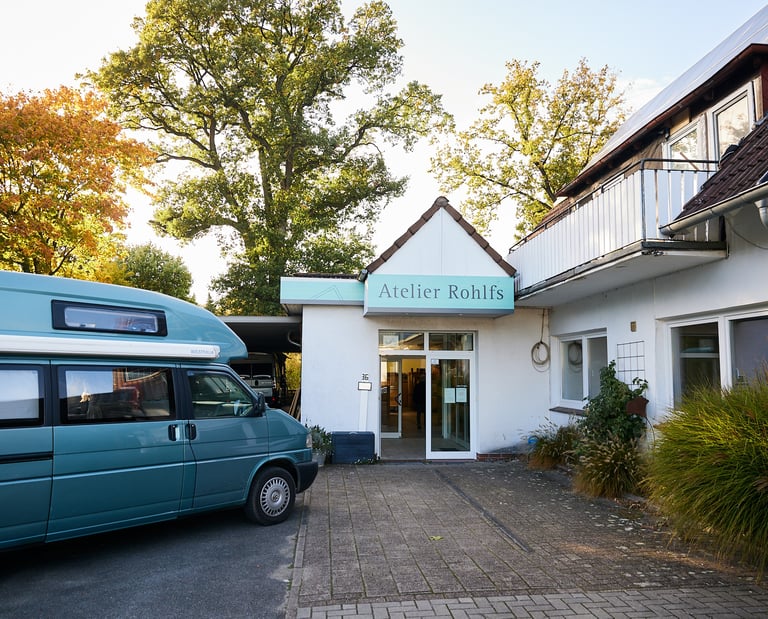 a van parked in front of a building, atelier rohlfs, frameworke