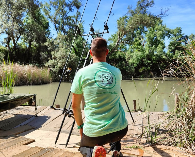 a man is fishing on a dock with a fishing rod