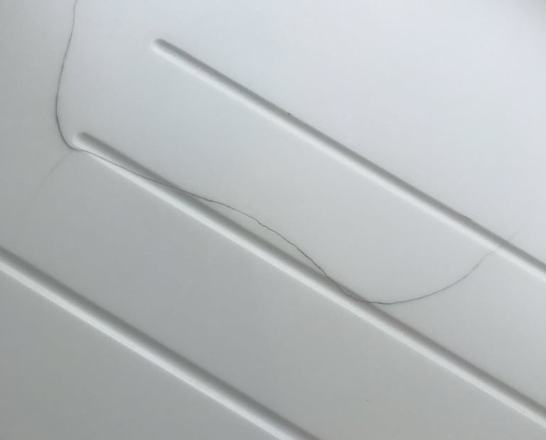 Solid surface kitchen worktop which had been badly damaged.