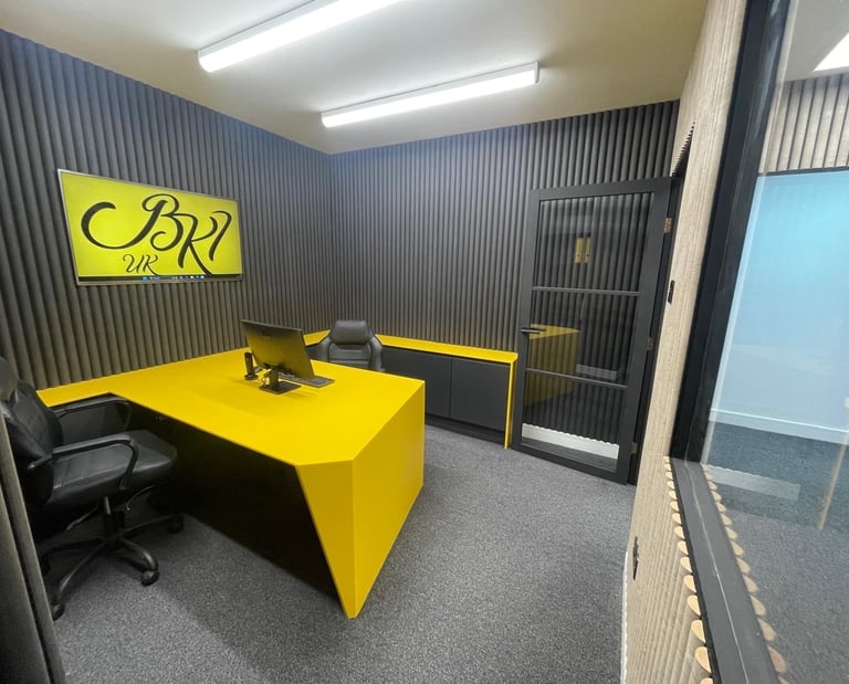A modern office with sleek HIMACS surfaces and curved acoustic walls, blending style and function.