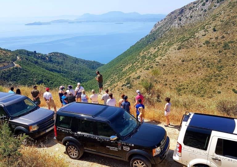 a group of people standing on a hill top