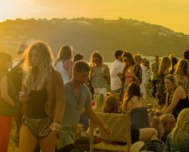 a group of people standing around a table