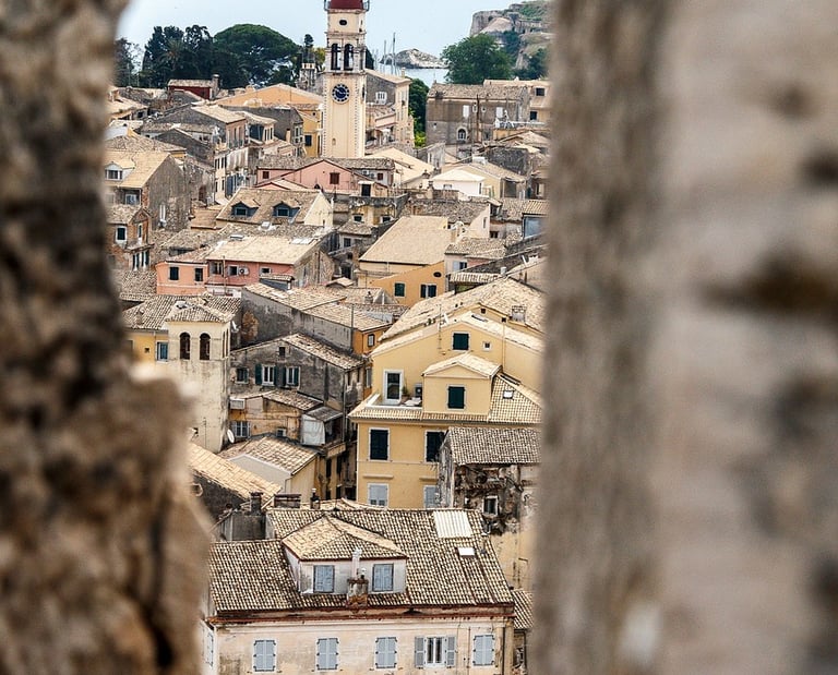 a clock tower with a clock tower in the background