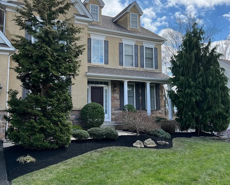 excellent landscaping and hardscaping of grass, stones and trees by NP Landscaping