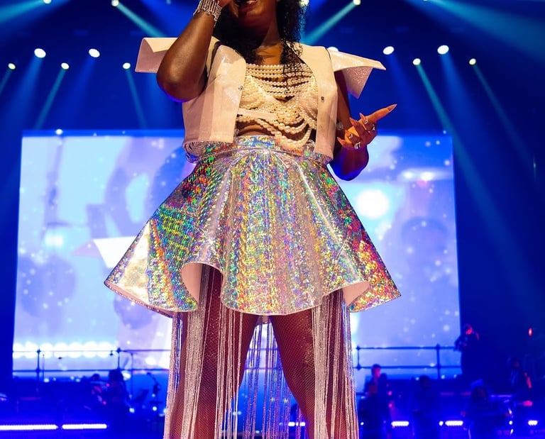a woman in a white dress and a microphone