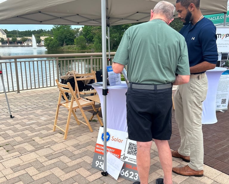 a man and a consultant standing in front of a tent
