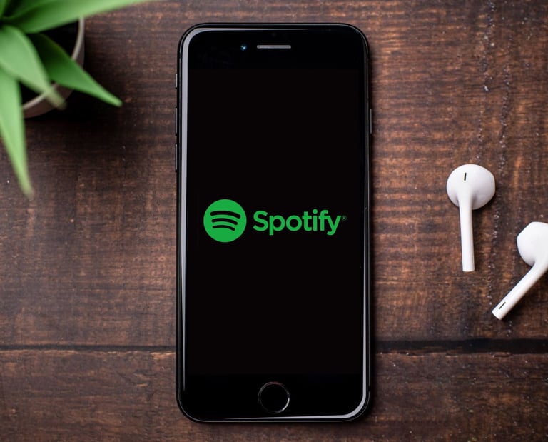 a phone next to pair of earphones