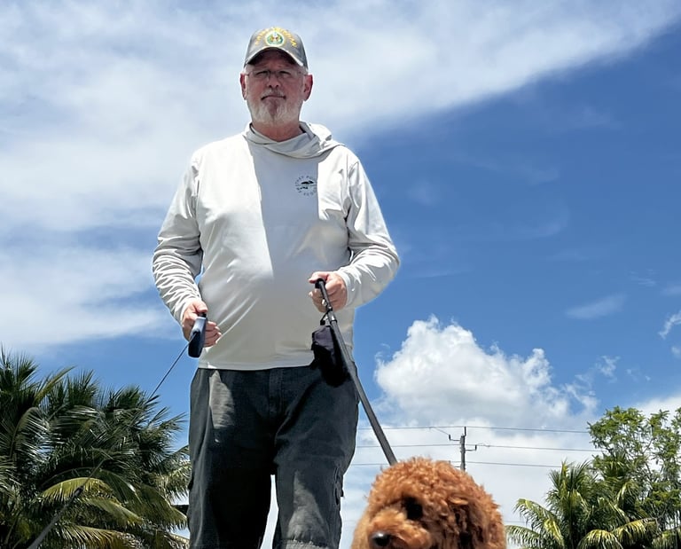Robert walking a dog on a leash