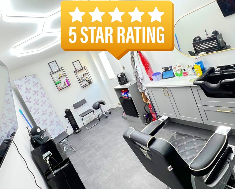 Interior of YAU Barber Studio featuring modern barber chairs, clean setup, and a 5 star rating badge.