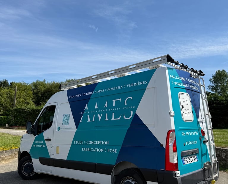 A white Renault Master utility van with AMES metalwork branding parked under a clear blue sky.
