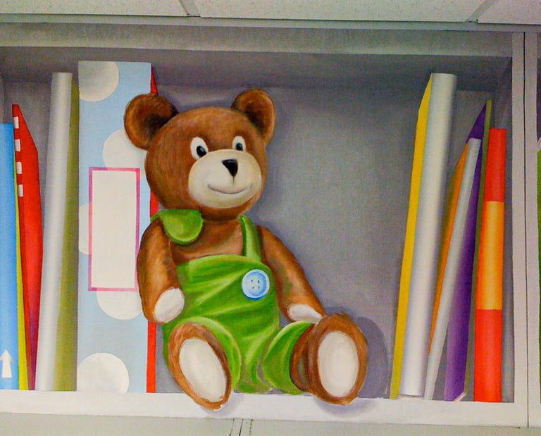 A painted bookshelf in trompe l'oeil style, showing a cute stuffed bear and fun colourful books