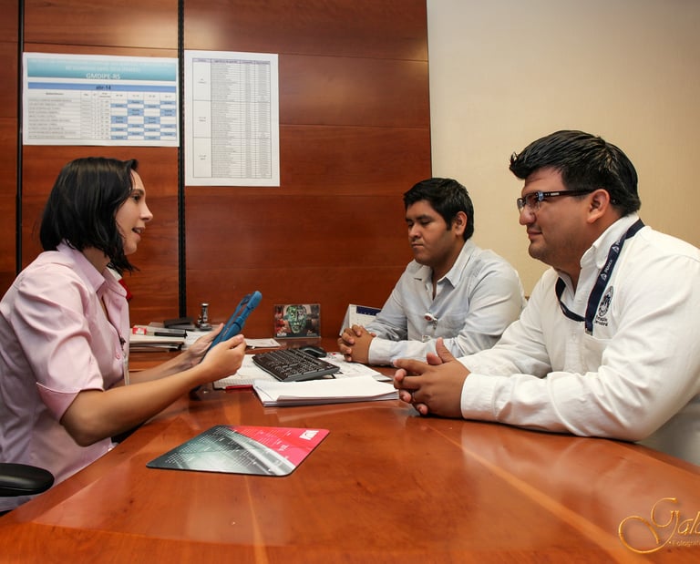 a group of doctors and nurses sitting around a table