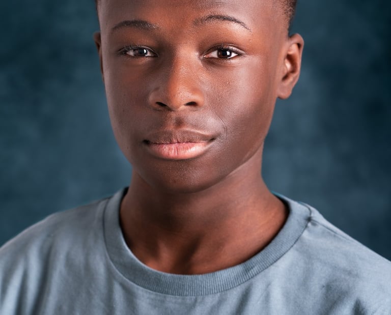 a young man with a blue shirt and a white shirt