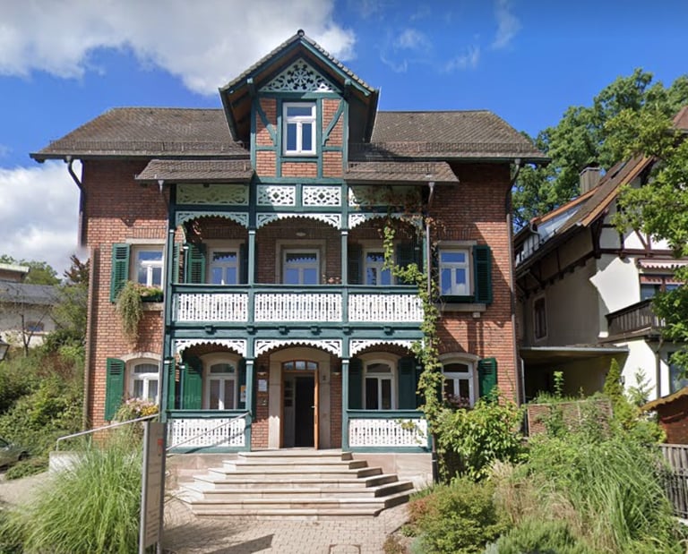a large house with a brick building and a brick building