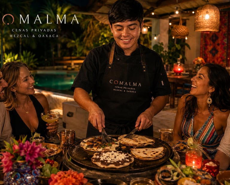A smiling chef serving authentic Oaxacan tlayudas and mezcal at a Comalma private dinner in Mexico.
